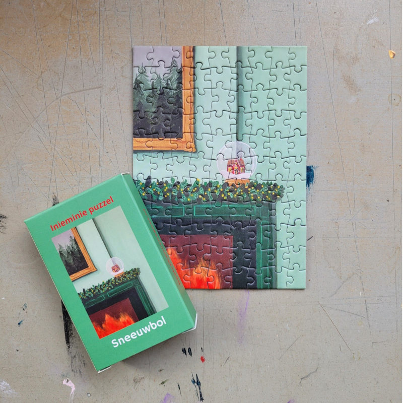 Een illustratie van een sneeuwbol op een inieminie puzzel van 99 stukjes.