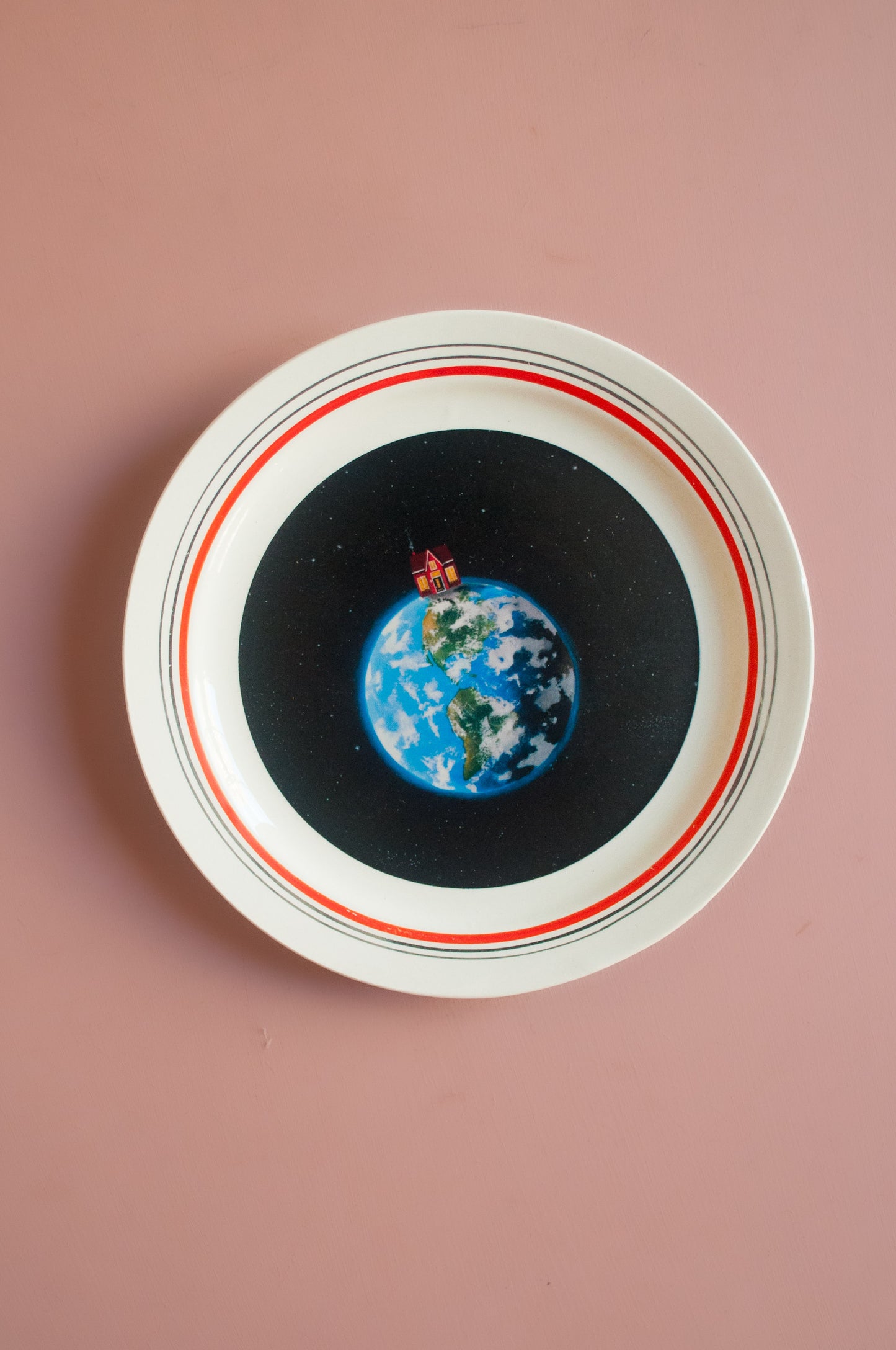 Wandbord huisje op de wereld