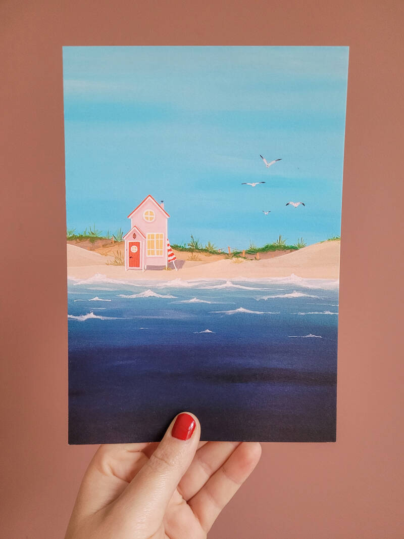 Een illustratie van een strandhuisje op een A5 print.