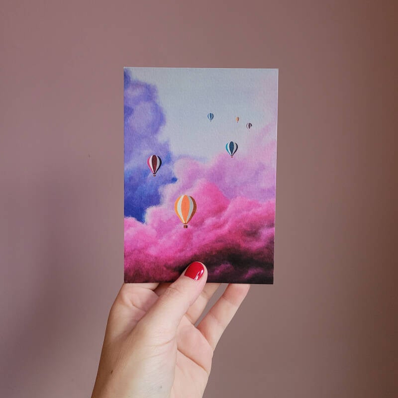 Een illustratie van luchtballonnen op een A6 ansichtkaart.