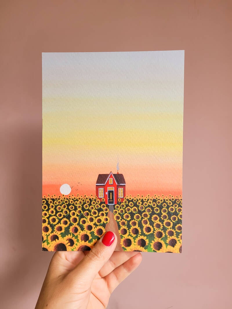 Een illustratie van een zonnebloem en een bij op een A5 print.