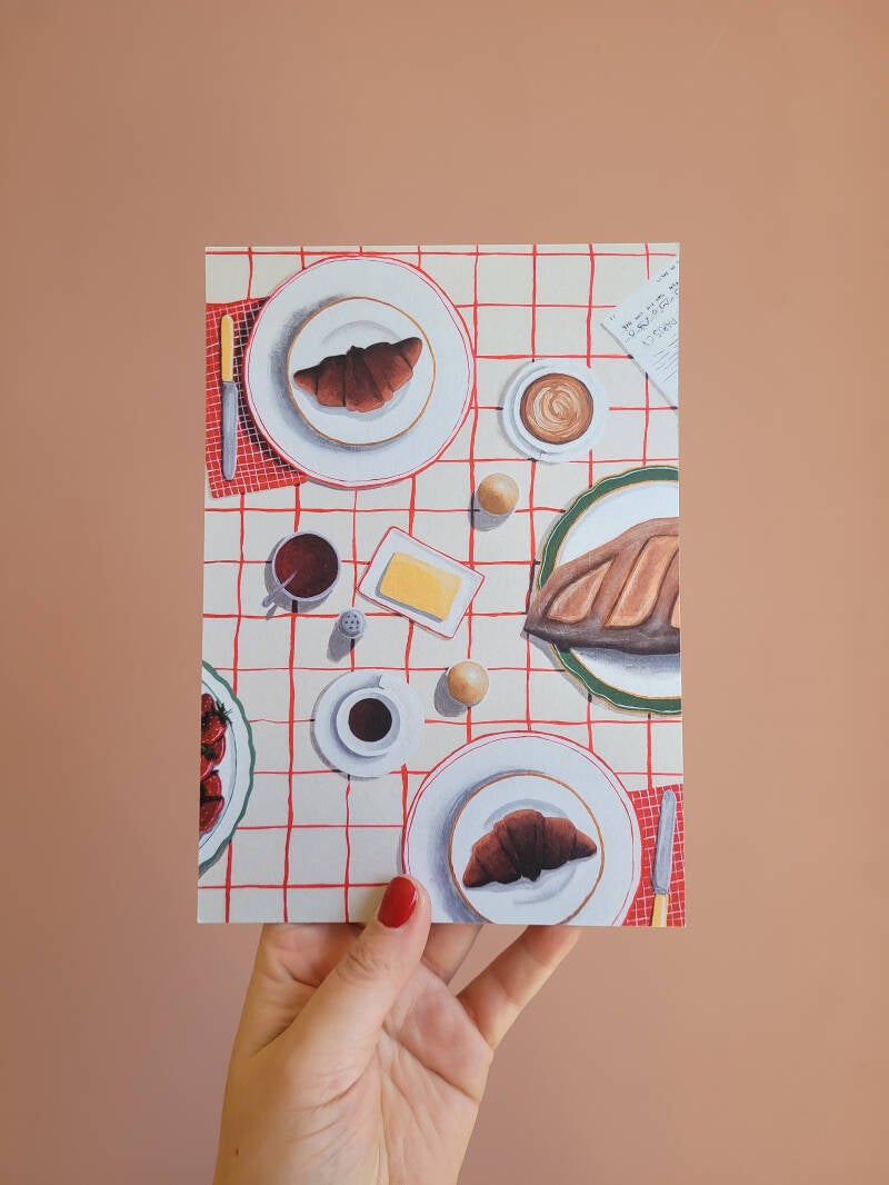 Een illustratie van een gezellige ontbijttafel op een A5 print.