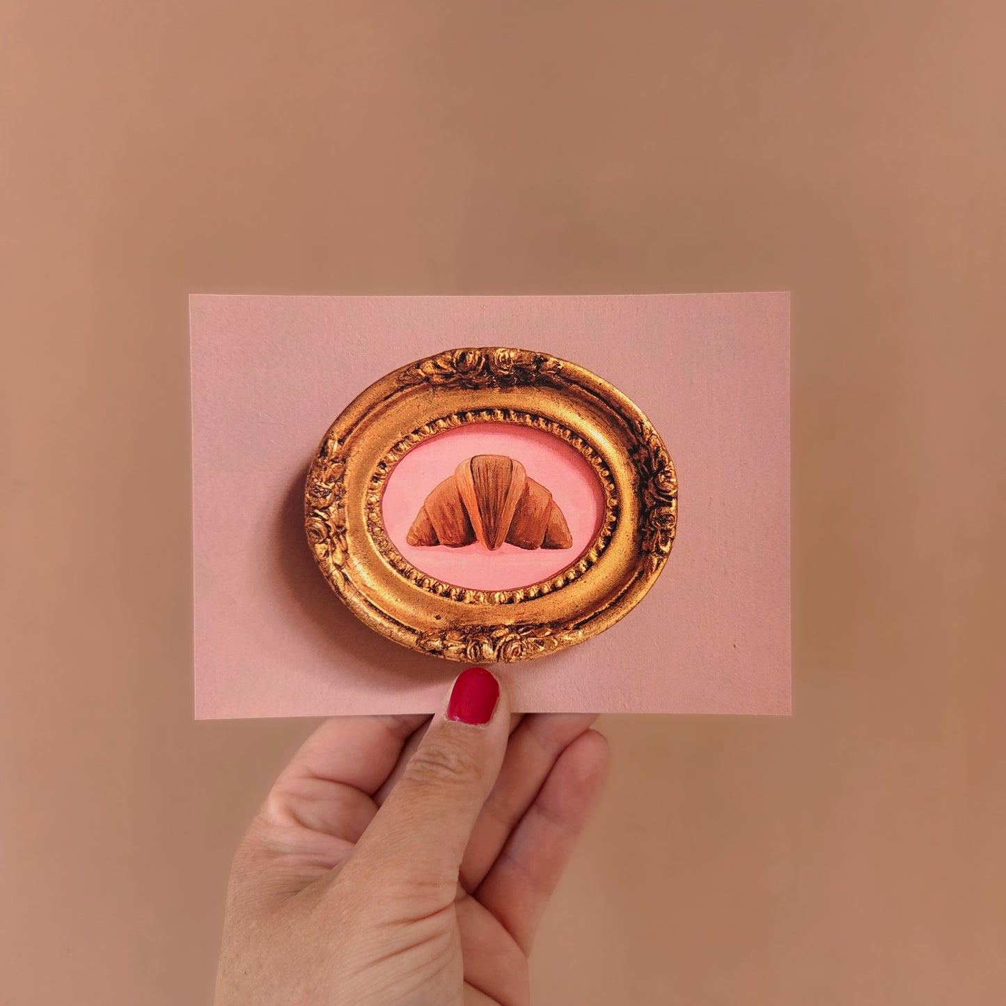 Kaart croissant in gouden lijstje